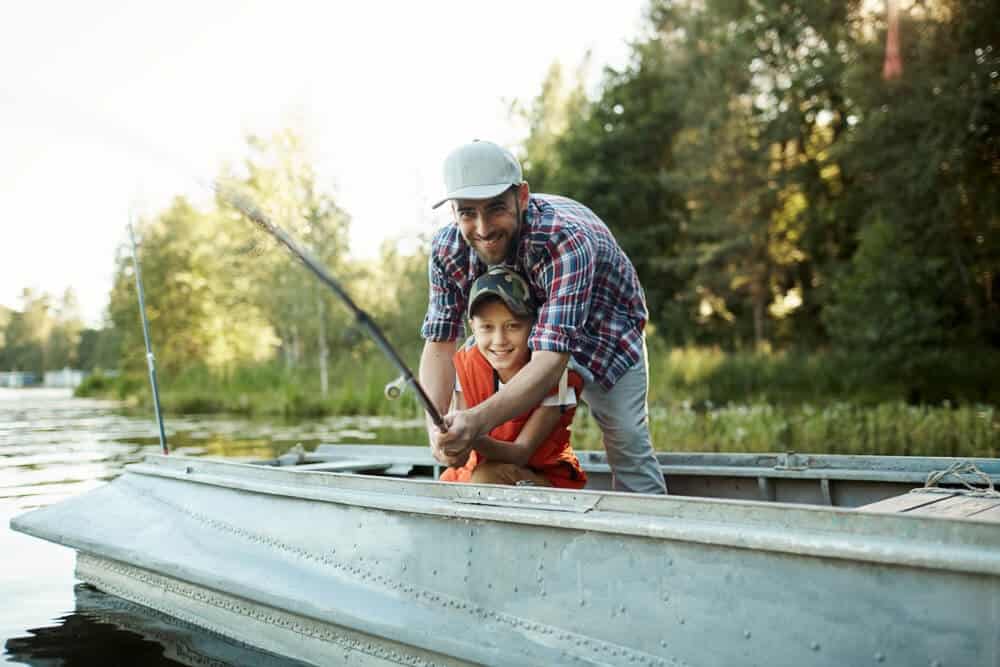 Father and Son Fishing from small boat